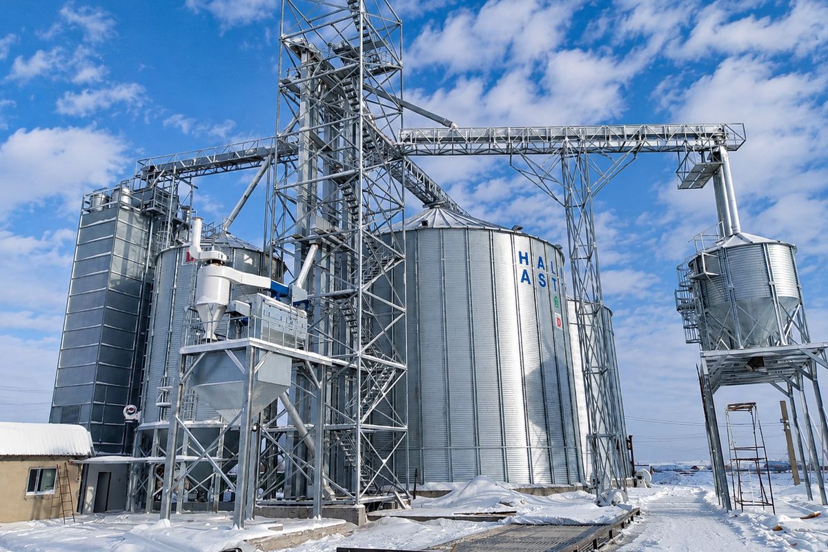 Silo complex in snow with hopper bins and cleaning plant